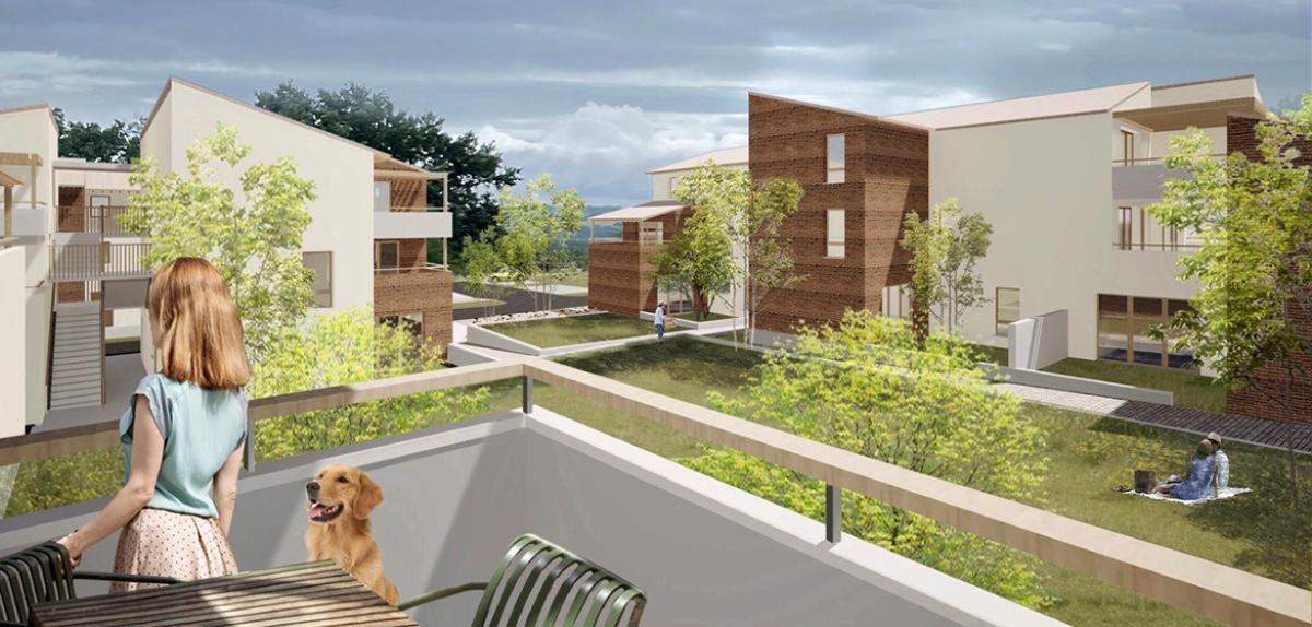 Cœur d’îlot d’Auz’village avec espaces verts et logements participatifs à Auzeville-Tolosane Résidence Auz’village à Auzeville-Tolosane, vue depuis un balcon sur les logements participatifs et espaces verts